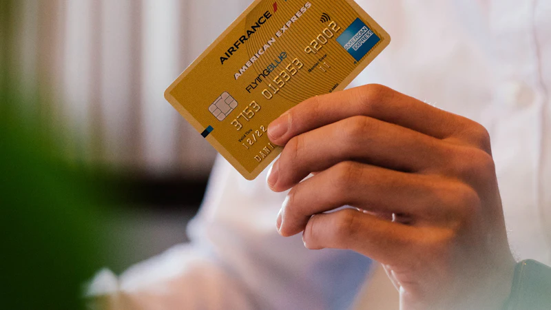 A person holding a credit card