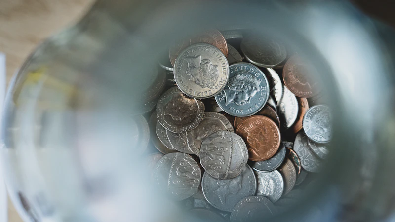 Silver round coins on a blue round container