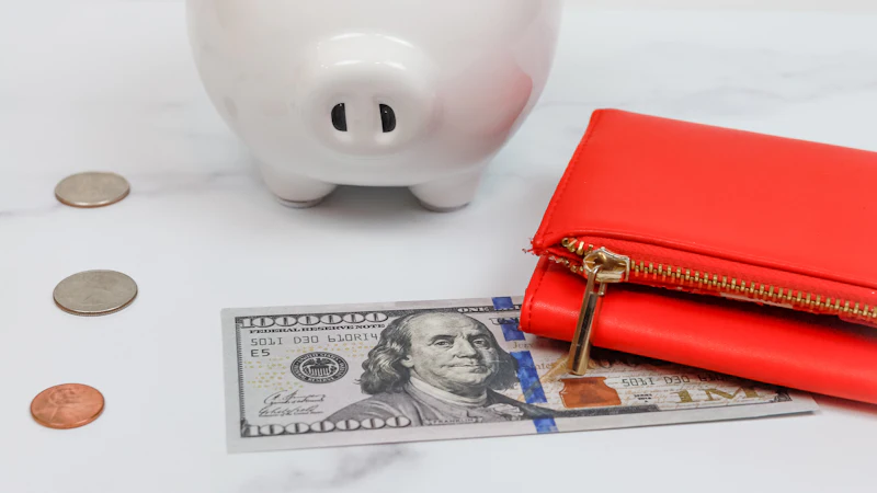 A piggy bank surrounded by a small pile of coins