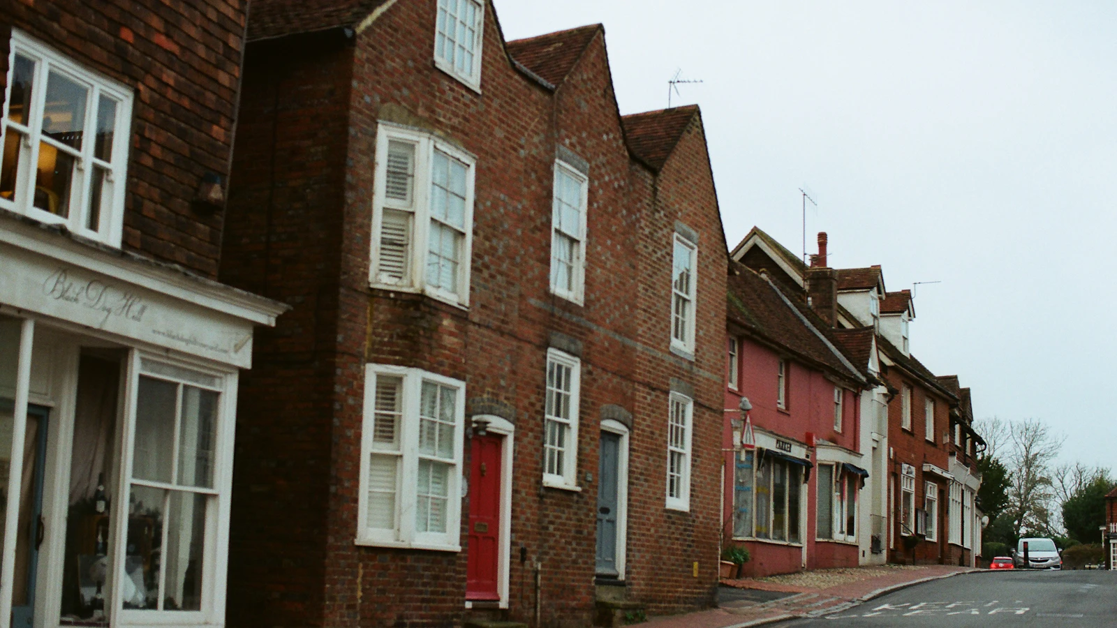 A row of brick buildings on a residential street